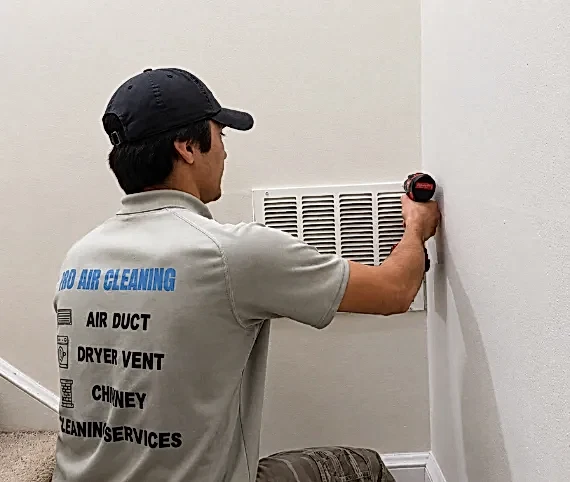 ABD technician cleaning an air duct in Fairfax, Virginia